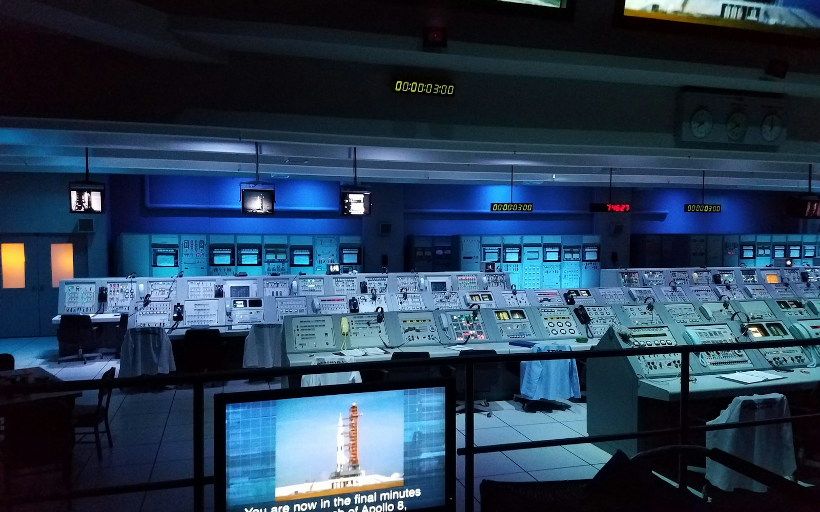 Control room with rows of consoles and monitors