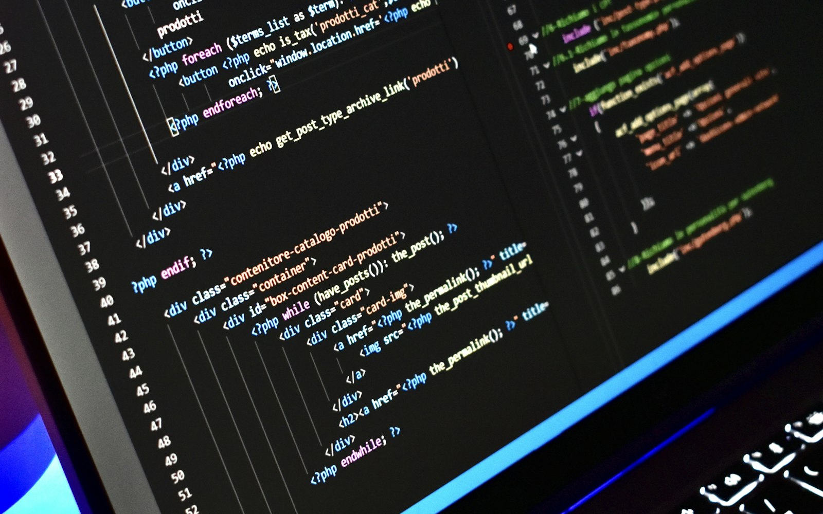 WordPress template PHP code on a laptop screen